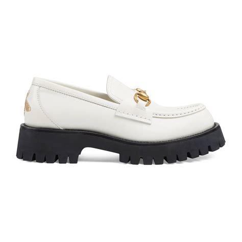 black and white Gucci loafers